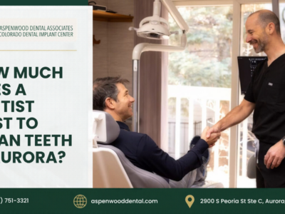 A dentist shakes hands with a patient in an exam chair. Text overlay: “How much does a dentist cost to clean teeth in Aurora?” and contact information for Aspenwood Dental Associates.